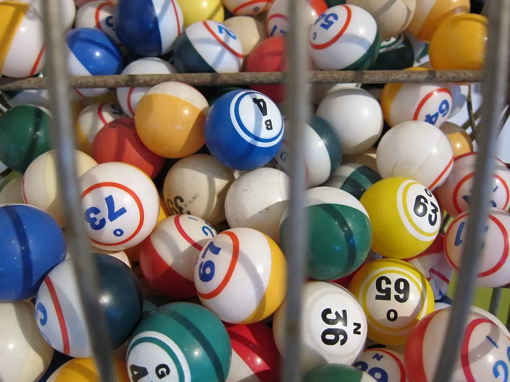 bingo online philippines real money - Numbered bingo balls inside a cage, representing online bingo for real money