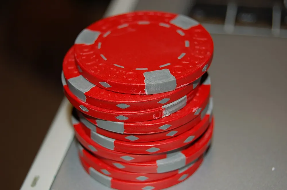 A stack of red casino chips - cashback casino philippines
