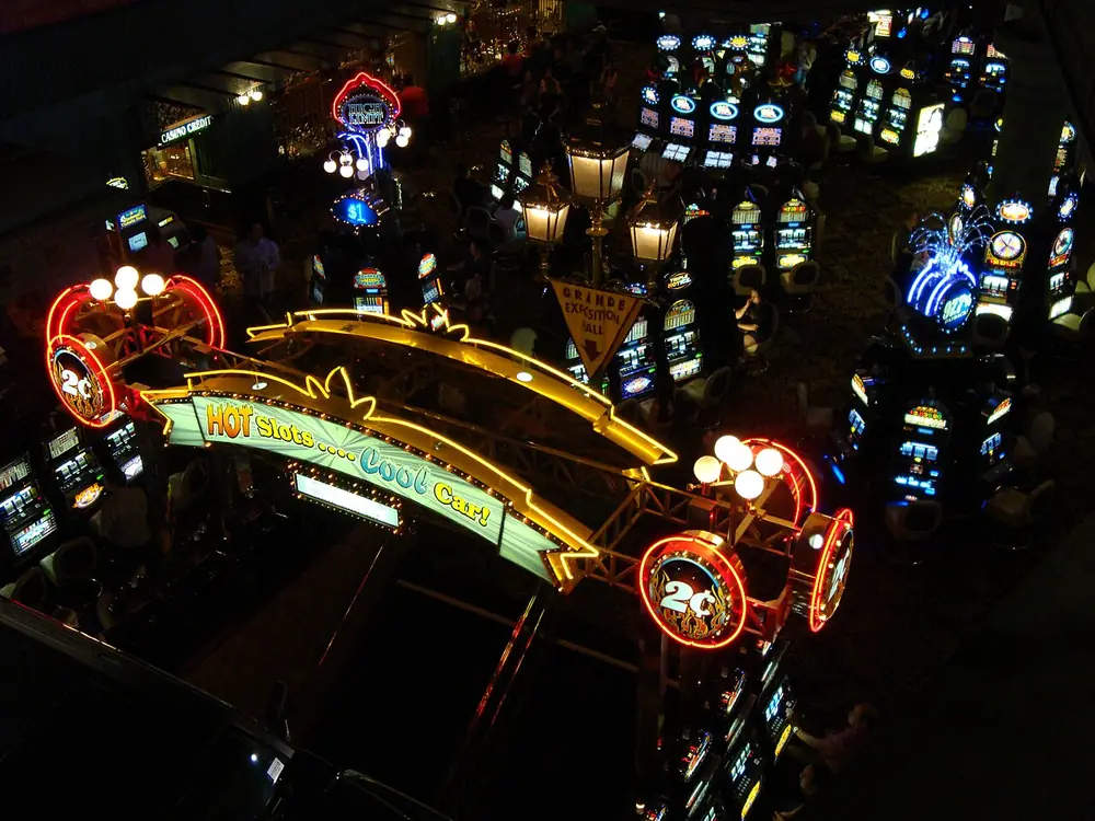 crypto casino free spins philippines - rows of slot machines on a casino floor