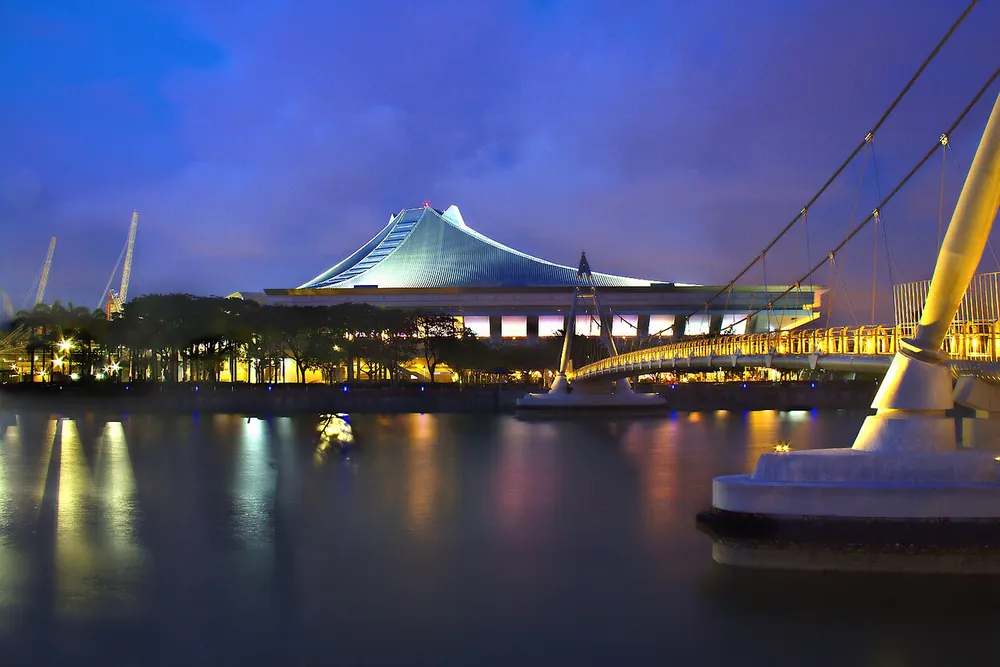 cs2 betting philippines - Singapore Indoor Stadium lit up at night beside the Kallang River