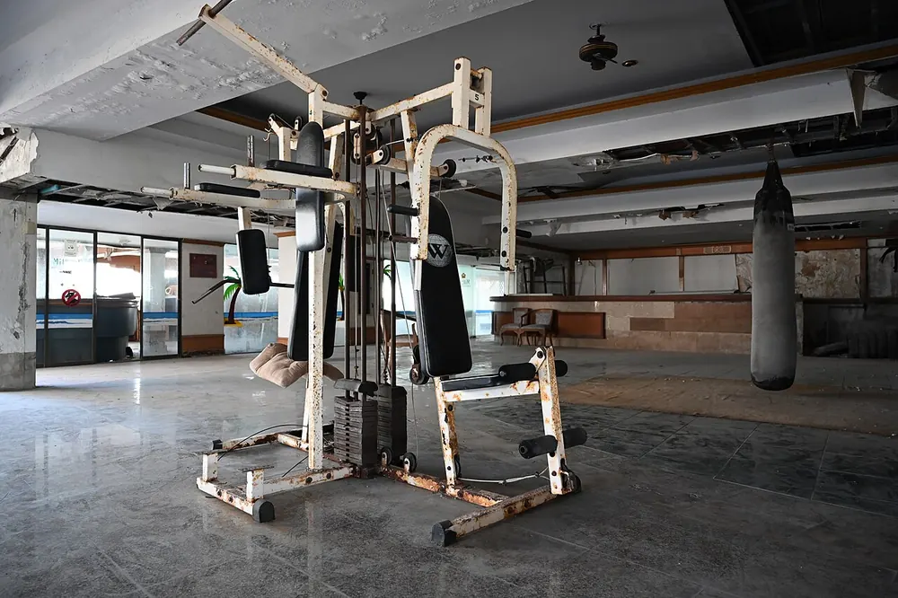 filipino boxer fight odds - Quiet boxing gym with a heavy bag and training equipment