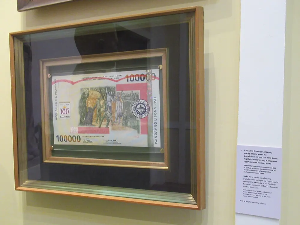 how to convert gcash to usdt - Framed Philippine 1000-peso banknote on display