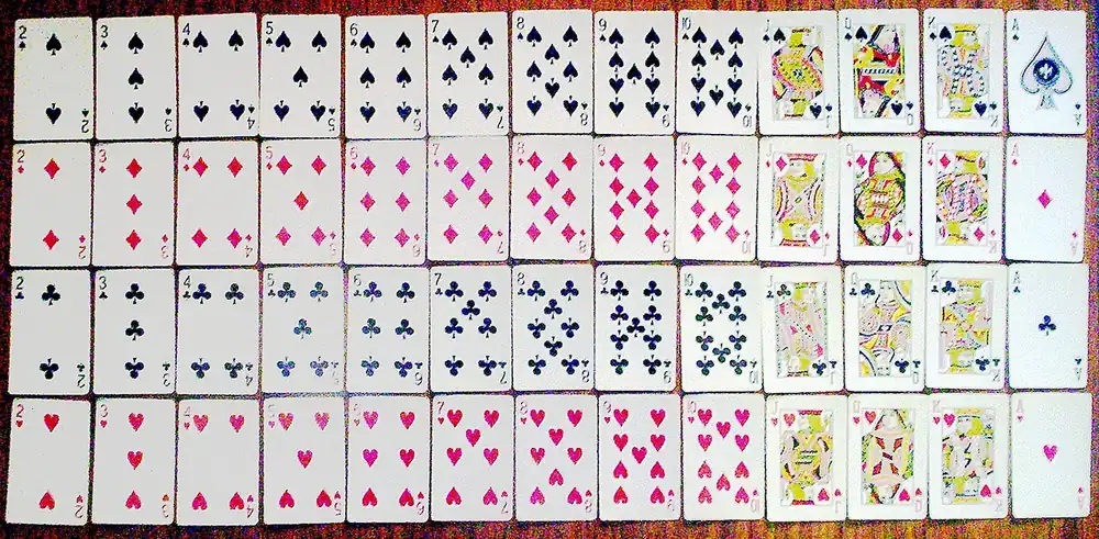 A full deck of playing cards laid out in rows - lucky 9 rules