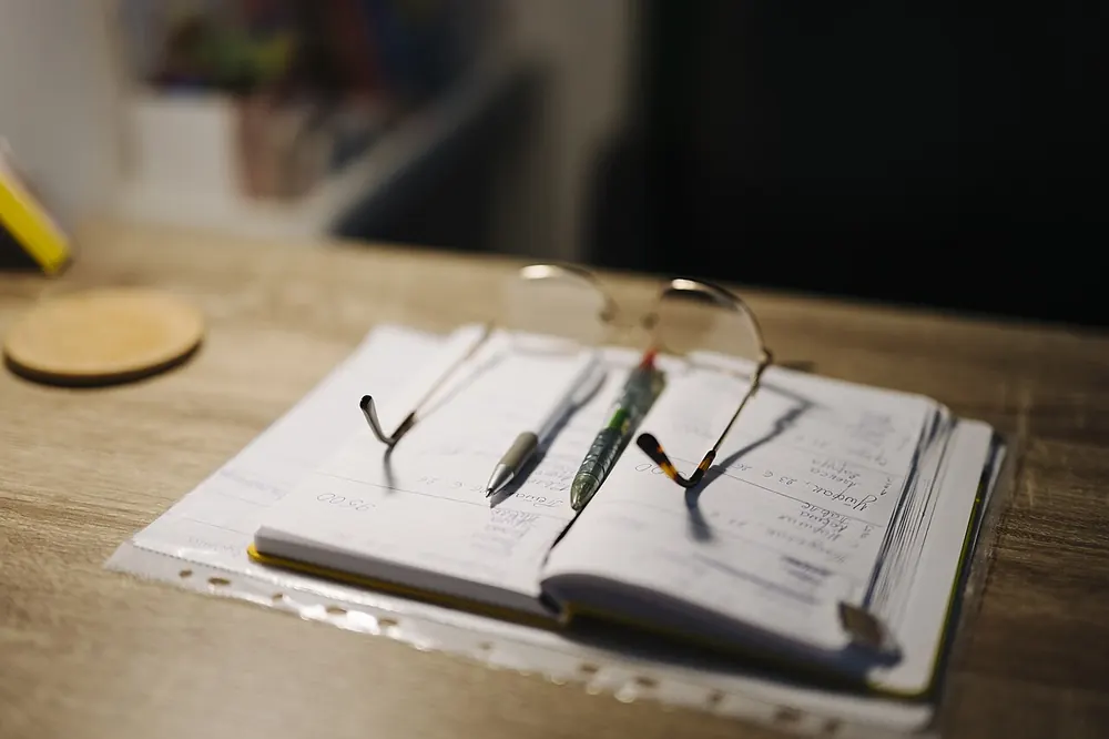 An open notebook and pen on a desk - nba betting tips today philippines