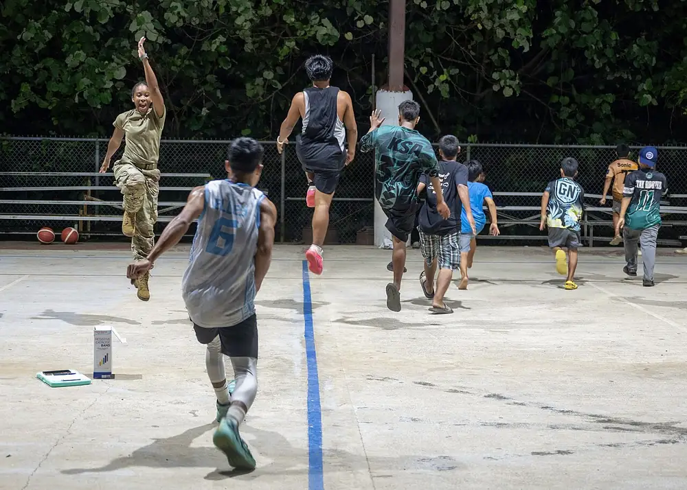 Players running on an outdoor basketball court, illustrating ncaa philippines basketball - ncaa philippines betting site