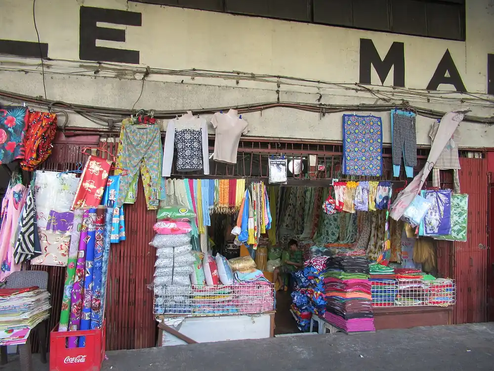 paano mag cash out ng usdt sa gcash - Textile stalls at a Manila market building