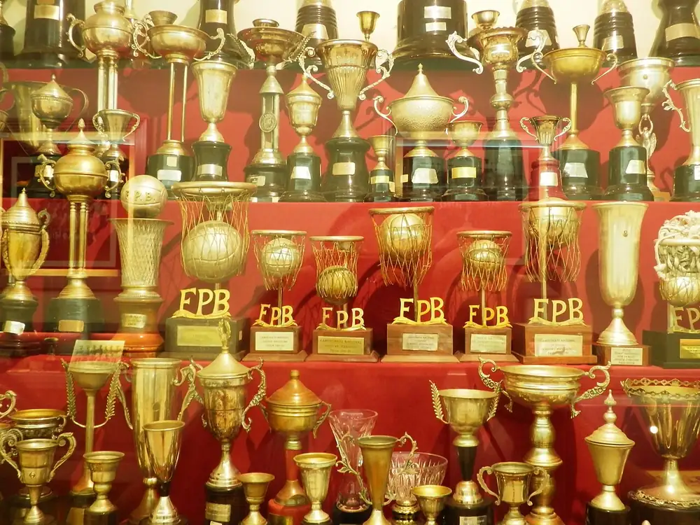 A shelf of sports trophies - paano tumaya sa pba finals