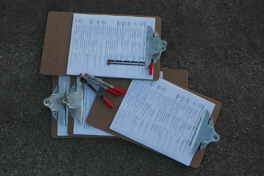 Clipboards with checklists, illustrating how to check a site against pagcor's official list - pagcor online casino list 2026