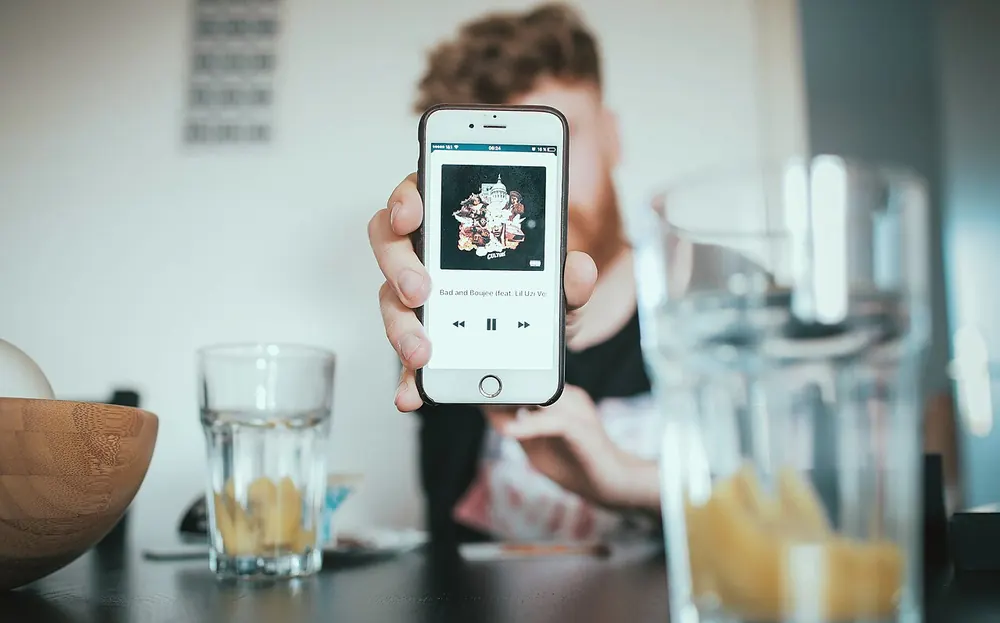 A smartphone held in one hand - pba betting app