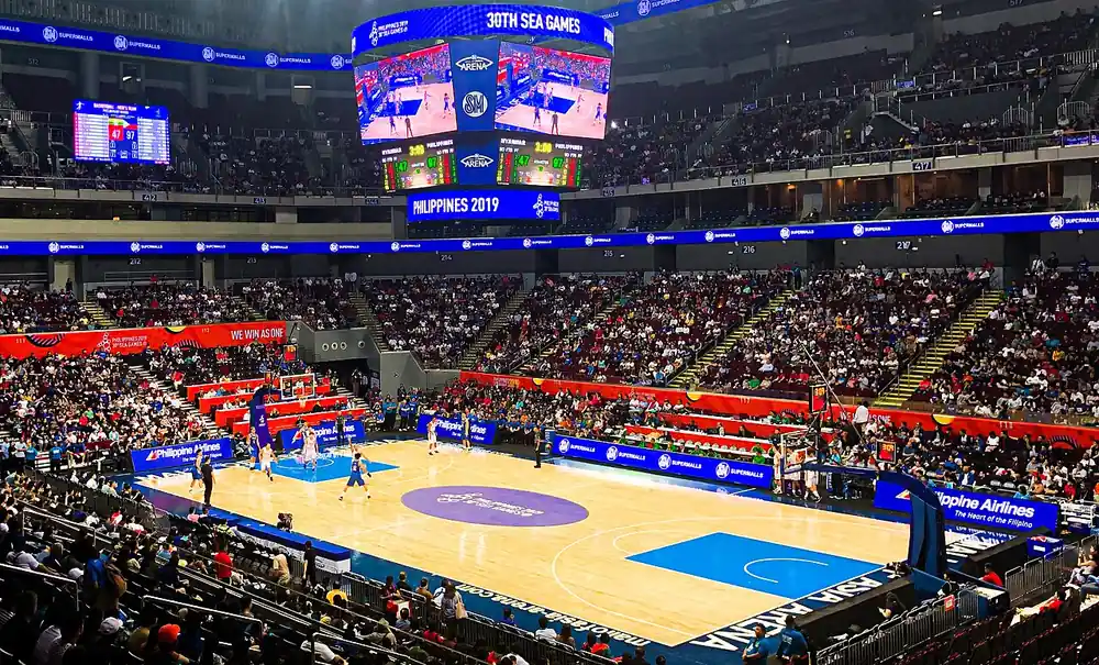 pba live betting - a basketball game under the lights at the Mall of Asia Arena