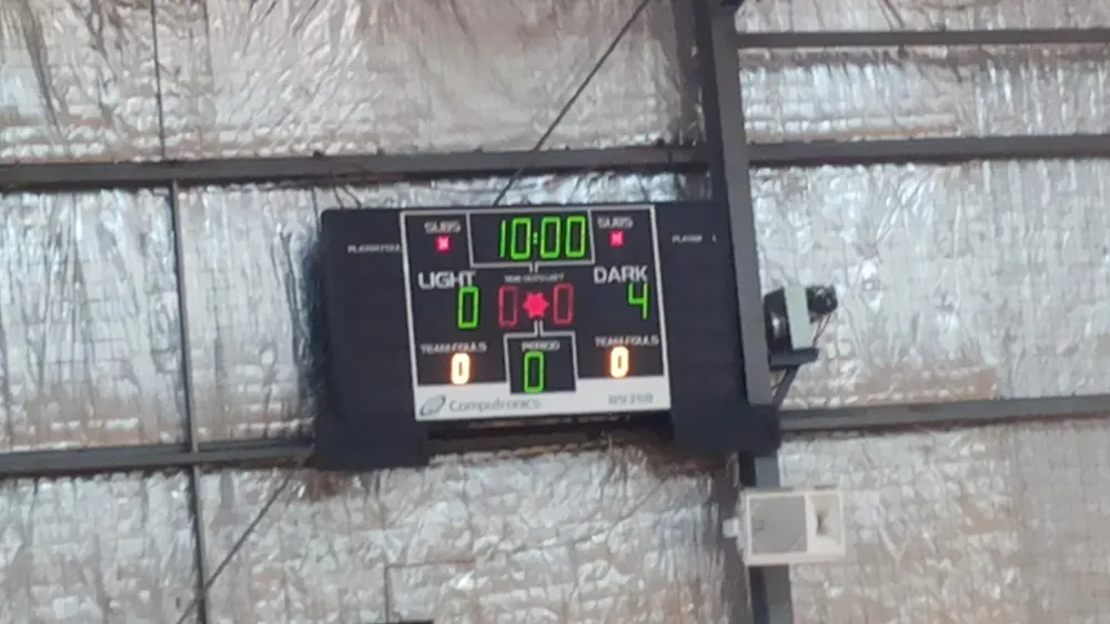 A simple digital scoreboard on a gym wall - pba live betting