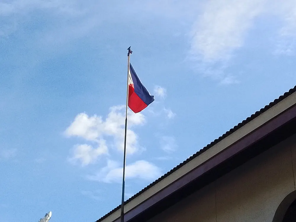 pba philippine cup odds - Philippine flag flying against a blue sky, illustrating PBA Philippine Cup all-Filipino odds