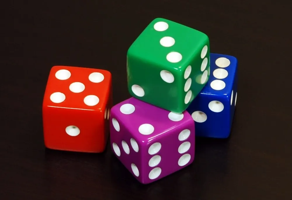 provably fair games explained - Colourful dice on a dark surface
