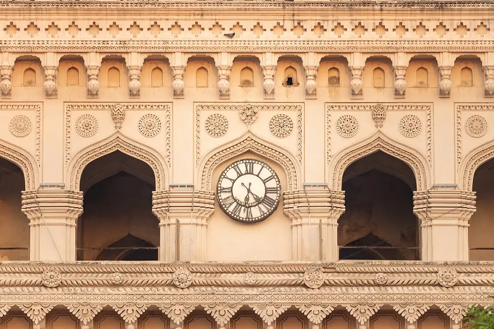 A clock on a historic building facade - pvl odds today