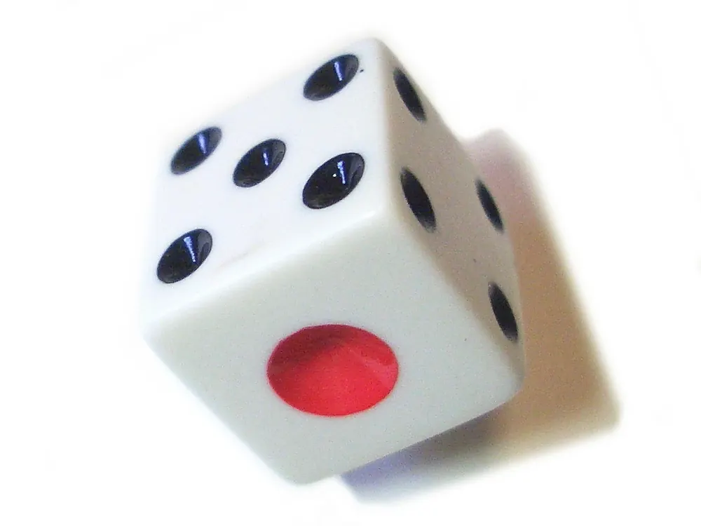 Close-up of a single die in motion - sic bo rules