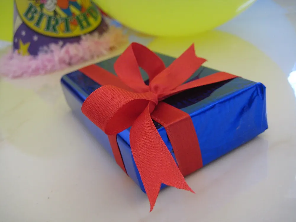 A gift box tied with ribbon - sports betting welcome bonus philippines