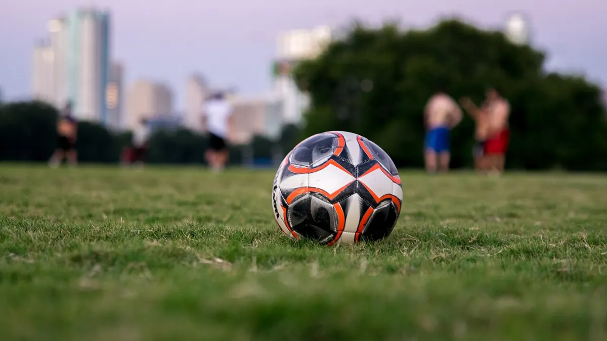 spread meaning in tagalog - football on a pitch