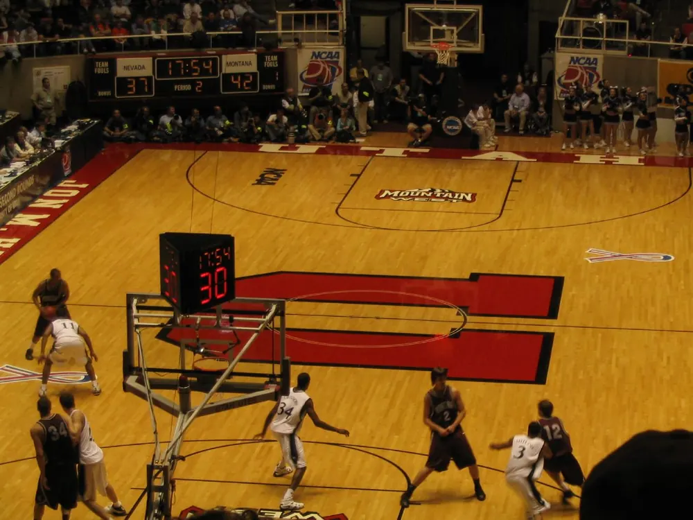 uaap basketball betting - Overhead view of a college basketball game in an arena, the subject of UAAP basketball betting