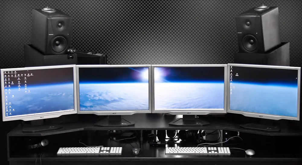 Computer monitors on a desk - uaap betting reddit