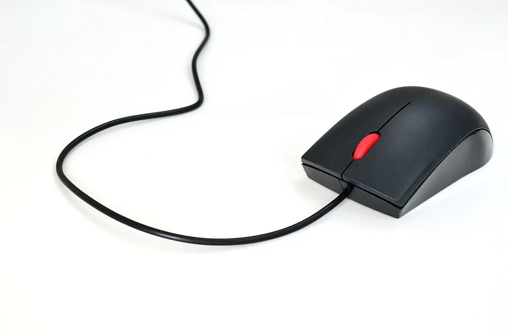 Wired computer mouse on a white background, illustrating tactical shooter esports betting - valorant betting site philippines