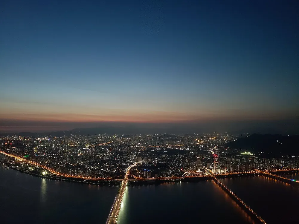 Seoul city lights along the han river at dusk - vct pacific odds