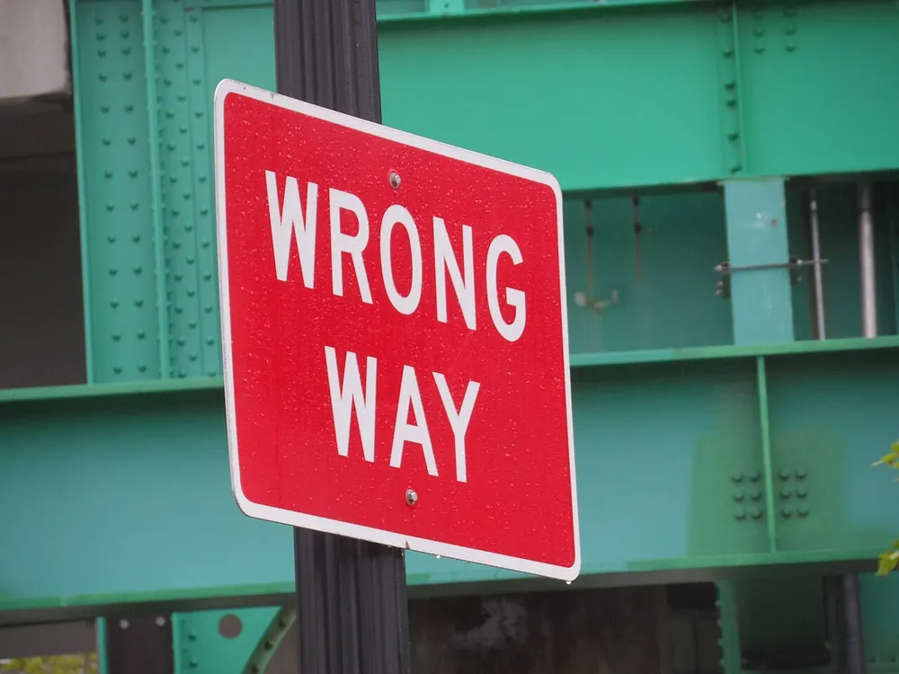 wrong network crypto deposit casino - Wrong Way road sign, illustrating a crypto deposit sent on the wrong network